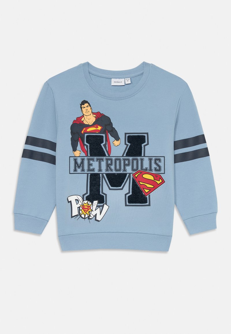 Helles blauer Sweatshirt aus Baumwolle, mit einem Superman-Graphic, dem Text "METROPOLIS" und schwarzen gestreiften Akzenten an den Ärmeln.