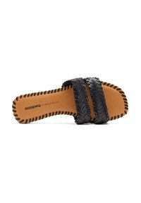 Sandali neri intrecciati a scivolo con suola piatta e soletta in pelle marrone. Bordo cucito e logo del brand impresso sotto.