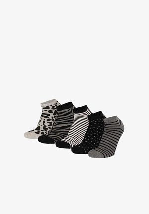 Five pairs of ankle socks in black, white, and gray with various animal and stripe patterns, displayed side by side on a white background.