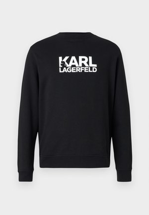Schwarzes Sweatshirt mit langen Ärmeln, Rundhalsausschnitt und gerippten Bündchen. Auf der Rückseite ist das weiße Logo "KARL LAGERFELD" aufgedruckt. Glatte Textur.