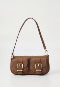 Brown leather handbag with two front pockets, gold hardware, and a short strap. Textured surface and rectangular shape.