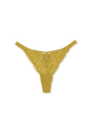 Geel kanten slip met bloemenpatronen en gegolfde randen, plat weergegeven op een witte achtergrond.