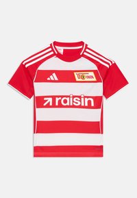 Rdeča in bela črtasta majica s kratkimi rokavi in okroglo ovratnikom, ki ima logo 1. FC Union in besedo "rozina" v beli barvi. Tri črte na rokavih.