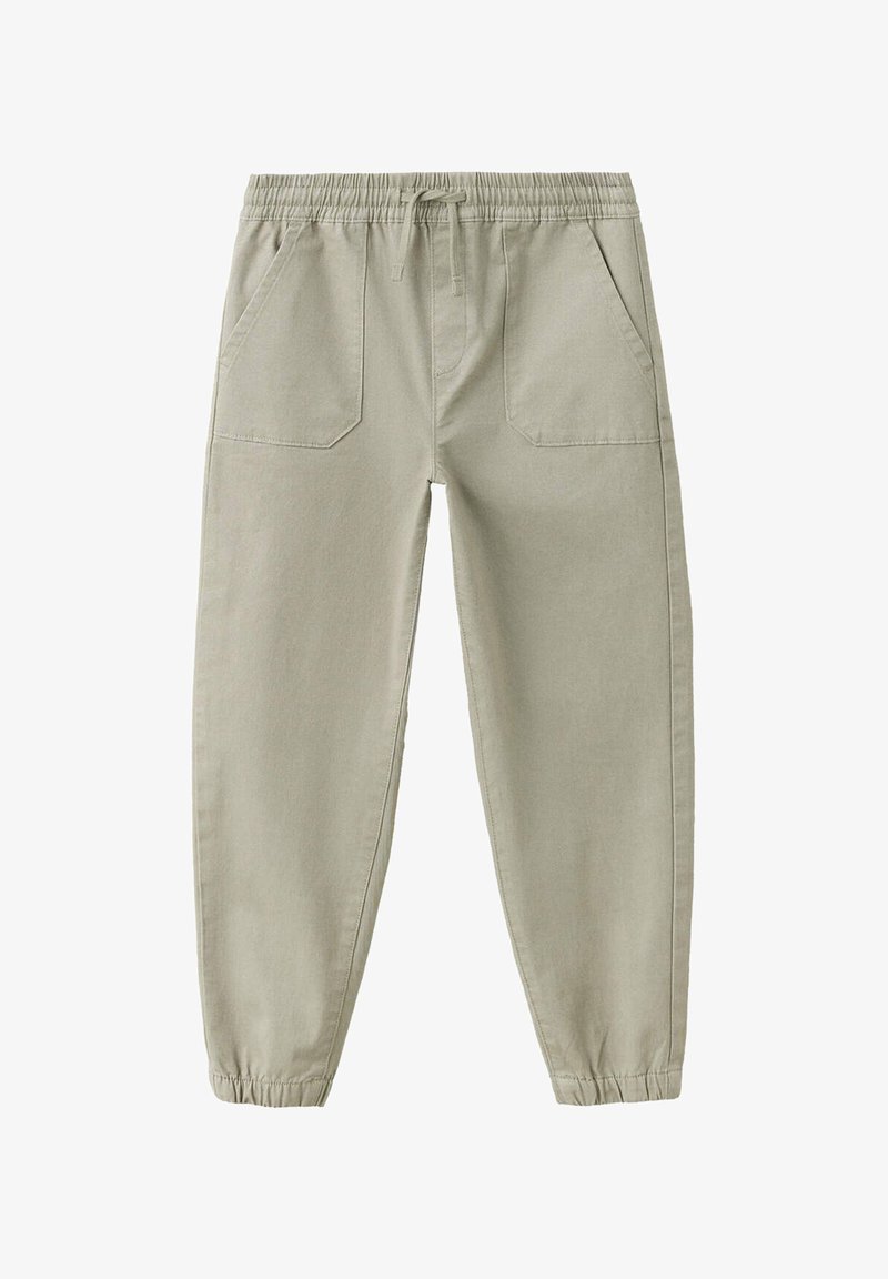 Pantalon beige décontracté avec taille élastique et cordon de serrage, poches plaquées à l'avant et bas élastiqués aux chevilles.