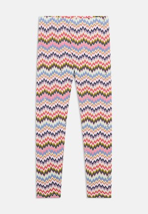 Többszínű leggings, amelyen zigzag mintázat található rózsaszín, kék, zöld és sötétlila színekben. Puha, rugalmas anyagból készült.