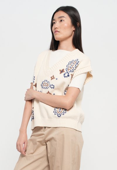 Strickweste in Creme mit blauer und brauner floralem Stickerei, V-Ausschnitt und kurzen Ärmeln. Strukturierter Rippenbund und lockere Passform.