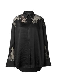 Schwarze Hemdbluse mit transparenten Spitzenverzierungen an Schultern und Ärmeln. Weicher Stoff mit lockerer Passform und abgerundetem Saum.