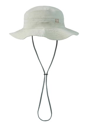 Light beige wide-brim bucket hat with adjustable black chin strap and small rectangular logo patch on the side.