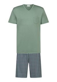 Green cotton V-neck T-shirt with a chest pocket above patterned shorts in navy blue with small white and red floral designs.