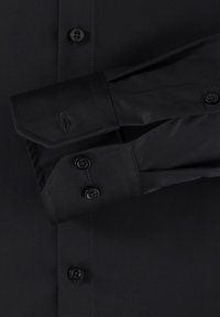 Black long-sleeve shirt with a smooth texture, featuring a button-down front and curved cuffs. It has black buttons and a subtle logo detail.