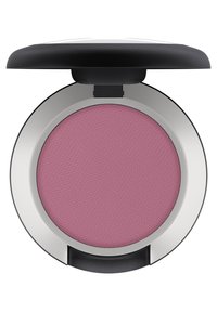 Ronde blushcompact met een getextureerd, roze poeder binnenin. De doos heeft een zwarte bovenkant en een glanzende zilveren onderkant, ontworpen voor draagbaarheid.