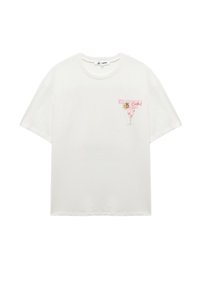Hvid bomulds T-shirt med korte ærmer, med et pink og grønt grafik af et cocktailglas og tekst på brystet.
