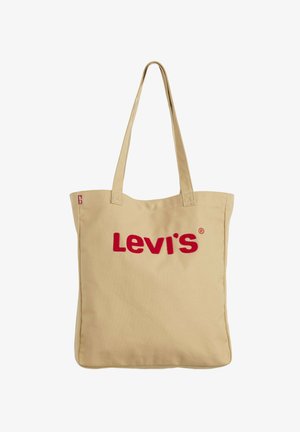 Sac fourre-tout en toile beige avec deux poignées et le logo rouge « Levi's » centré sur le devant.