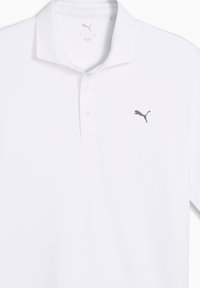 Λευκό πόλο πουκάμισο από λείο ύφασμα, με κλασικό γιακά, τρεις κουμπότρυπες και γκρι λογότυπο Puma στο αριστερό στήθος.