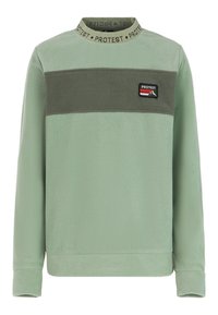 Žalias pūkuotas trikotažas su tekstūrine apdaila, turintis tamsiai žalios horizontalios juostos ir logotipo etikete krūtinėje. Suapvalintas kaklo dizainas.