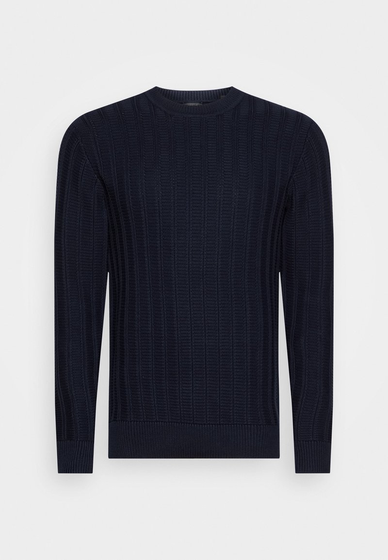 Pull en maille côtelée bleu marine avec col rond, manches longues et poignets ajustés, présenté sur un fond blanc.