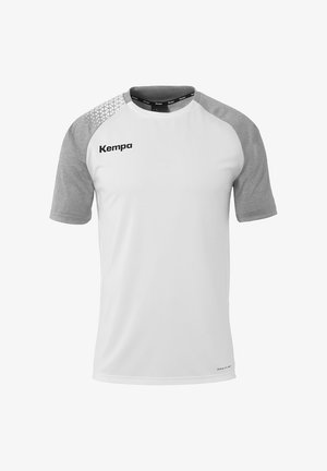 Witte sport t-shirt met korte mouwen en grijze raglanmouwen, met textuuraccenten en het "Kempa"-logo op de voorkant. Gemaakt van ademend materiaal.