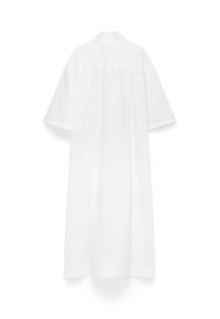 Long white shirt dress with short sleeves and a back yoke, displayed on a plain white background.