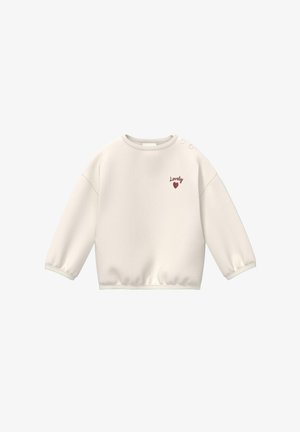 Sweat-shirt bébé à manches longues de couleur crème avec le texte « Lovely » et un cœur rouge sur la poitrine, doté de deux boutons-pression sur l'épaule.