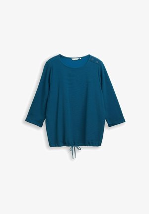 Teal long-sleeve top with a round neckline, button accents on the shoulder, and a drawstring hem for adjustable fit. Soft texture.