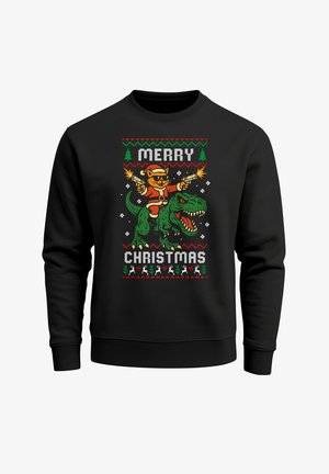 Black sweatshirt featuring a colorful graphic of a cat in a Santa suit riding a green dinosaur, with "MERRY CHRISTMAS" text in bold letters.