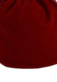 Red velvet drawstring bag with a smooth texture and gathered top. Features a round base and seamless finish, highlighting the rich color.