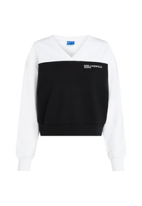 Felpa cropped in bianco e nero, con scollo a V, maniche lunghe e logo ricamato. Realizzata in morbido tessuto misto cotone.