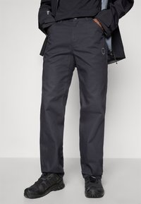 Dark grey, lightweight outdoor pants with a straight leg design, featuring front pockets and a small logo on the left side.