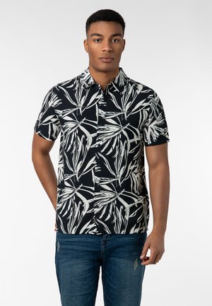 Schwarzes Kurzarmhemd mit weißem botanischem Druck, kragenloses Design, Knopfleiste und lockere Passform, aus leichtem Material gefertigt.