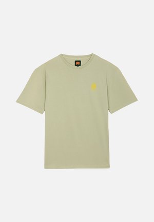 Light green short-sleeve T-shirt with small yellow sun and mountain logo on left chest and a black tag with orange elephant at collar.