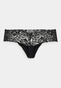 Zwarte kanten string met een brede kanten tailleband met bloemmotieven. Zacht, ondoorzichtig middenstuk met golvende randen op de tailleband.