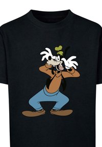 Černé tričko s potiskem komiksové postavy v světle hnědém a modrém oblečení, s velkými bílými rukavicemi a hravým postojem.