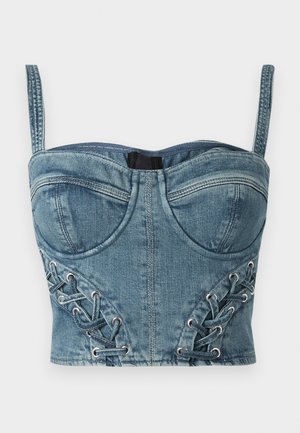 Kratki denim bustier plave boje, s podesivim naramenicama, strukturiranim čašama i detaljima od bočnih šupljih očica s tkanim naglasima.