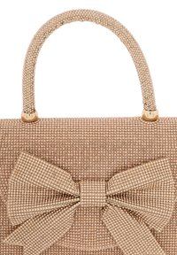 Beige handbag featuring a textured surface with small beads, a structured shape, and a large bow accent. Gold hardware on the handle.