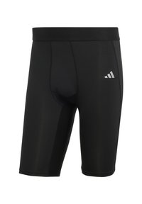 Schwarze Sportshorts aus glattem, dehnbarem Material. Sie haben eine enganliegende Passform, einen elastischen Bund und ein dezentes weißes Logo an der Seite.
