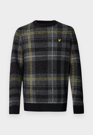 Black, gray, and white plaid sweater with yellow accents, ribbed neckline and cuffs, made of soft material with a logo detail on the chest.
