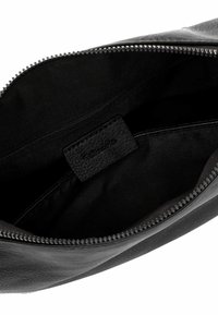 Black leather clutch bag with a smooth texture, zip closure, and an inner label. Interior lined in black fabric. Compact, rectangular shape.