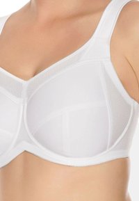 White bra featuring a soft, smooth fabric with mesh accents, full-coverage cups, and wide adjustable straps for support and comfort.