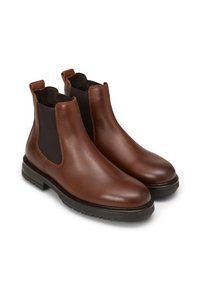 Bottes Chelsea en cuir marron avec des panneaux latéraux élastiques, bout arrondi, semelle en caoutchouc robuste et languettes en haut pour un enfilage facile.
