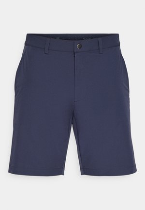 Marineblå shorts laget av lett materiale, med flat front, beltehemper og en enkelt frontlomme med en ren hem.