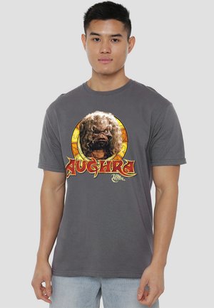 Gray T-shirt made of cotton, featuring a colorful graphic of a creature's face with the text "Aughra" below, in a retro style.