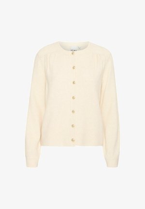 Cardigan crem dintr-o țesătură moale. Are un guler rotund, sleeves lungi și șase butoane aurii pe față. Bază simplă cu dantelă.