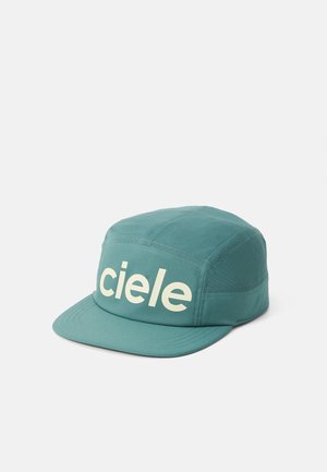 Teal cap with a flat brim, featuring a white "ciele" logo on the front. Made of lightweight fabric with a textured finish.