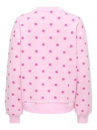 Ροζ φούτερ με μεγάλα φούξια πουά, στρογγυλή λαιμόκοψη και μακριά μανίκια. Διαθέτει ριμπ τελειώματα στα μανίκια και στο τελείωμα για άνετη εφαρμογή.