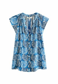 Tunique bleue à manches courtes, présentant un motif coquillage blanc. Tissu léger, encolure en V, et fermeture par boutons à l'avant.