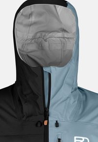 Hooded jacket, featuring black and light blue panels. Zip closure, with a texture resembling a waterproof fabric. Lined interior detail visible.