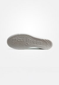 Le sneaker Paul Green presentano una suola in gomma grigia testurizzata con un motivo a punti in rilievo e il logo del marchio impresso. Il design include un bordo bianco.
