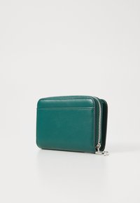 Green leather wallet with a zip closure, rectangular shape, smooth texture, and subtle stitching detail on the surface.
