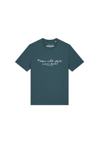 Die donkere teal t-shirt met korte mouwen heeft witte handgeschreven tekst in het Duits die zegt "Wenn nicht jetzt, wann dann?" gecentreerd op de voorkant.