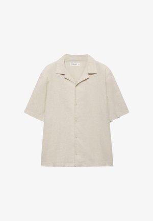 Chemise beige à manches courtes avec fermeture à boutons, col style camp et coupe décontractée, fabriquée en tissu léger.